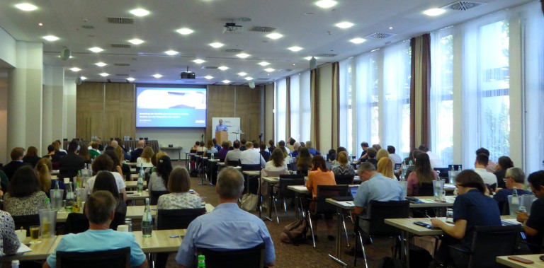 photo of the event hall with participants